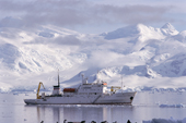 Ex Russian survey vessel Professor Multanovskiy with a backdrop of Anvers Is from Cuverville Is. Antarctica