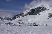 Glaciers tumble from the mountains on Ronge Island, seen from Cuverville Is. Antarctic Peninsula.