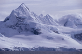Dramatic peak of Mount Doumer and glaciated slopes on Wiencke Island. Antarctic Peninsula.