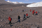 Visitors to the Taylor Dry Valley pick their way over fragile mossbeds by the Canada Glacier. Antarctica.