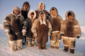 Inuit children of the Taqqaugaq family dressed in caribou skin clothing. Baffin Is., Nunavut, Canada. 1987