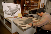Kananginak Pootoogook, an acclaimed Inuit artist working in the print shop at Cape Dorset, Nunavut, Canada. 2002