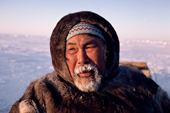 Tatigat, an Inuit hunter, his breath frozen into his beard. Igloolik, Nunavut, Canada. 1993