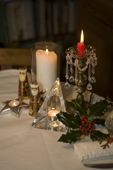 Candles and holly at Christmas. Dorset. England