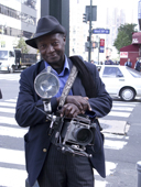 New York Photographer Louis Mendes with his Crown Graphic Press Camera outside the B&H store in Manhattan. NY