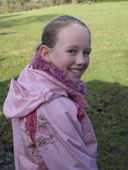 Paige displays her muddy pink jacket, She is beating on a pheasant shoot in Hampshire. England