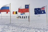 2009 Monaco Antarctic Expedition viewed through the flags of the 12 original Antarctic Treaty nations that surround the Ceremonial South Pole.