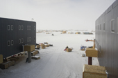 View from a window at US Amundsen-Scott South Pole Research station. Looking between accommodation blocks towards caches and equipment dumps beside the station.