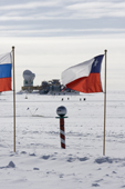 South Pole Telescope and Dark sector Lab beyond the cermonial South Pole and Flags of Nations. Antarctica