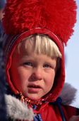 Swedish forest Sami boy in traditional red pom-pom hat at a Spring festival in Kautokeino, North Norway. 1996