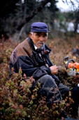 Uniam, an Innu hunter, smokes a pipe by Burnwood lake in Southern Labrador. Canada. 1997