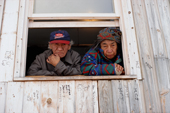 An Elderly Innu couple at the window of their home in Davis Inlet. Northern Labrador, Canada. 1997