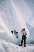 Man on a glacier /ice climb with mobile phone and laptop. Alaska