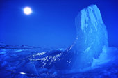 Moonlit Iceberg taken at midday during the polar night. Ice polished by the wind. N.W. Greenland. 1980