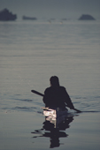 An Inuit out hunting in his kayak at midnight in summer. Inglefield Bay. N.W.Greenland. 1985