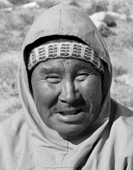Portrait of Qalaseq Duneq an elderly Inuk from Qaanaaq wearing a wooly hat and traditional anorak. Thule Northwest Greenland. 1971