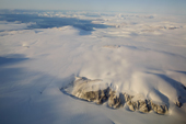 Icecap and glaciers and exposed mountains near Cape York on the Northwest coast of Greenland. 2008