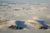 Icecap and glaciers surround nunataks near Cape York on the Northwest coast of Greenland. 2008