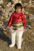 Anne Sofie, a young Inuit girl from Qaanaaq, in traditional dress on her third birthday. Northwest Greenland. 2008