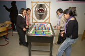 Inuit girls playing table football at the Youth Club in Qaanaaq. Northwest Greenland. 2008