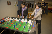 Inuit girls playing table football at the Youth Club in Qaanaaq. Northwest Greenland. 2008