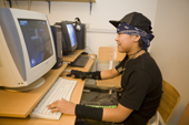 Inuit boy playing a computer game at the Youth Club in Qaanaaq. Northwest Greenland. 2008