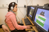 An Inuit girl playing computer games at the Youth Club in Qaanaaq. Northwest Greenland. 2008