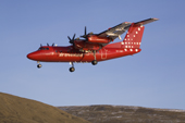 An Air Greenland Dash-7 plane about to land arriving at Qaanaaq. Northwest greenland. 2008