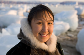 Sofie Jensen, a young Inuit woman, dressed in traditional sealskin jacket with fox fur ruff. Qaanaaq, Northwest Greenland. 2008