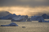 Icebergs and small pieces of glacial ice floating in Inglefield Bay at sunset. Northwest Greenland. 2008