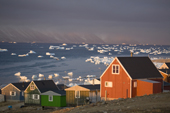 Houses in the Inuit community of Qaanaaq, on the shore of Inglefield Bay in autumn. Northwest Greenland. 2008