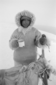 Otto Simigak with a mug of tea during a break on a hunting trip in light snow. Siorapaluk, Northwest Greenland. 1977