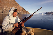 Lars Kaerngak out seal hunting in his boat near Savissivik. N.W. Greenland. 1991
