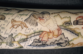 A detail from a Chukchi legend engraved on walrus ivory by Oxana Enes of Uelen. Chukotka, Siberia, Russia. 2004
