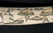A detail from a Chukchi legend engraved on walrus ivory by Emnrykayin of Uelen. Chukotka, Siberia, Russia. 2004