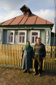 Mikhail Sobelev and his wife Alexandra outside their 100 year old home in Pogost. Ryazan Province, Russia. 2006