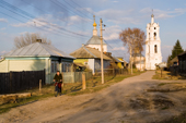 Street scene in the village of Pogost with the church of St. Nikolai in the background. Ryazan Province, Russia. 2006