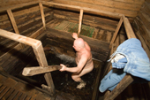 A man bathing in Bazhenovskiy Spring. The water is known for its healing properties. Ryazan Province, Russia. 2006