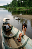 Children playing in a wooden boat on the river at Chazylar. Republic of Tuva. Siberia. 1998