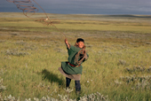 Valera Serotetto, a Nenets boy, practises throwing his lasso. Yamal, W. Siberia, Russia