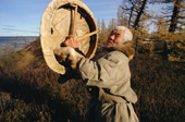 Hek, an elderly Nenets man holding his sacred drum which he made in 1946. Yamal, W.Siberia, Russia