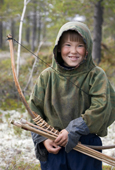 Dima Piak, a Forest Nenets boy, with his bow and arrow out hunting birds in the summer. Purovsky Region, Yamal, Western Siberia, Russia