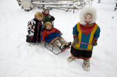 Forest Nenets children playing outside at a winter camp in the Purovsky Region of the Yamal. Western Siberia, Russia