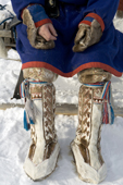 A Forest Nenets man wearing traditional reindeer skin winter boots. Purovsky Region, Yamal. Western Siberia, Russia