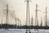 Pylons and gas flares in the Vingoyarhinsky oil fields. Purovsky Region, Yamal, Western Siberia.