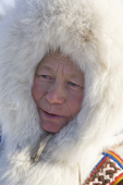 Tanya Seratetto, a Nenets woman, in traditional dress with fox fur hood. Yamal, Western Siberia, Russia