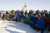 Nenets men listen to a speech at a reindeer herders festival in the Yamal. Western Siberia. Russia
