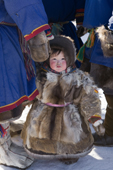 Paulina Serotetto, a young Nenets girl dressed in reindeer fur clothing at a reindeer herders festival in the Yamal. Western Siberia, Russia