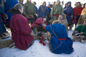 Nenets men competing in a trial of strength competition at a reindeer herders festival in the Yamal. Western Siberia, Russia
