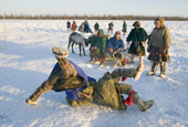 Two Nenets men competing in a wrestling competition at a reindeer herders festival in the Yamal. Western Siberia, Russia